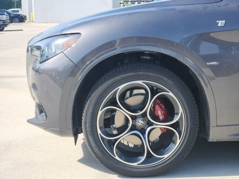 2024 Alfa Romeo Stelvio Ti in a Vesuvio Gray Metallic exterior color and Chocolateinterior. Northside Imports Houston 281-475-4549 northsideimportshouston.com 