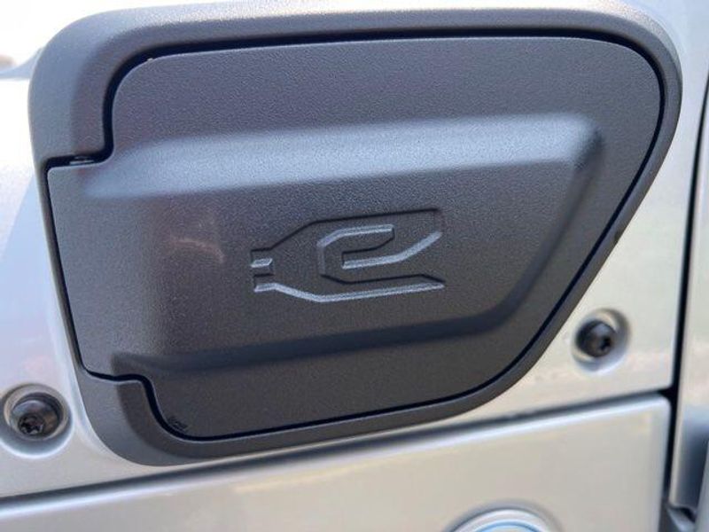 2023 Jeep Wrangler Sahara 4xe in a Silver Zynith Clear Coat exterior color and Blackinterior. Lakeshore CDJR Seaford 302-213-6058 lakeshorecdjr.com 