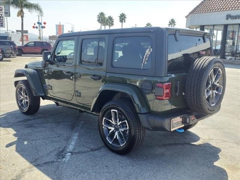 2024 Jeep Wrangler Sport S 4xe in a Sarge Green Clear Coat exterior color and Blackinterior. Perris Valley Auto Center 951-657-6100 perrisvalleyautocenter.com 