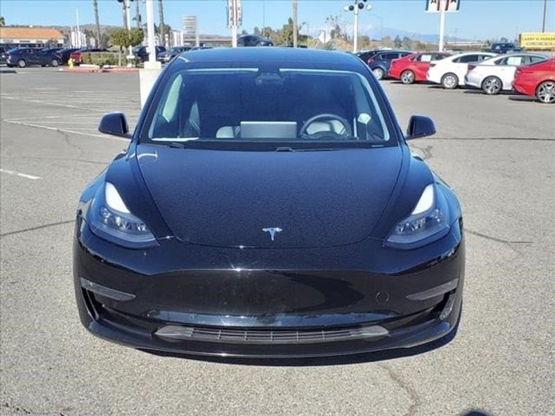 2021 Tesla Model 3 Long Range in a Black exterior color and Blackinterior. Perris Valley Auto Center 951-657-6100 perrisvalleyautocenter.com 