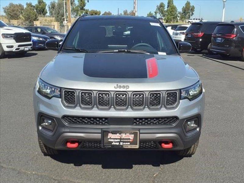 2024 Jeep Compass Trailhawk in a Billet Silver Metallic Clear Coat exterior color and Ruby Red/Blackinterior. Perris Valley Auto Center 951-657-6100 perrisvalleyautocenter.com 