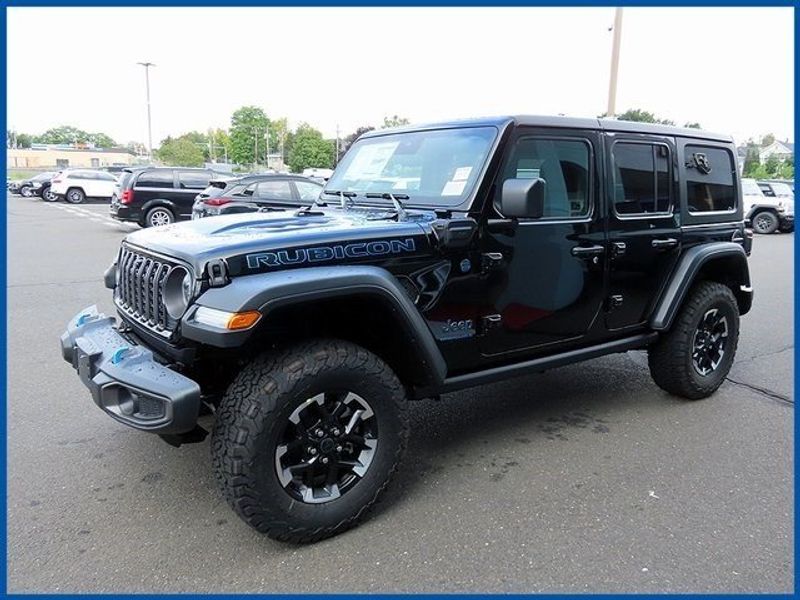 2024 Jeep Wrangler 4xE Rubicon 4xe in a Black Clear Coat exterior color and Blackinterior. Papas Jeep Ram In New Britain, CT 860-356-0523 papasjeepram.com 