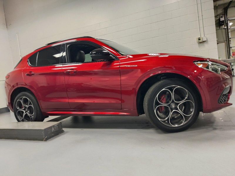 2023 Alfa Romeo Stelvio Veloce Q4 AWD w/Prem & Activ Pkg in a Rosso Etna exterior color and Black Heated Sport Leatherinterior. Schmelz Countryside Alfa Romeo and Fiat (651) 968-0556 schmelzfiat.com 