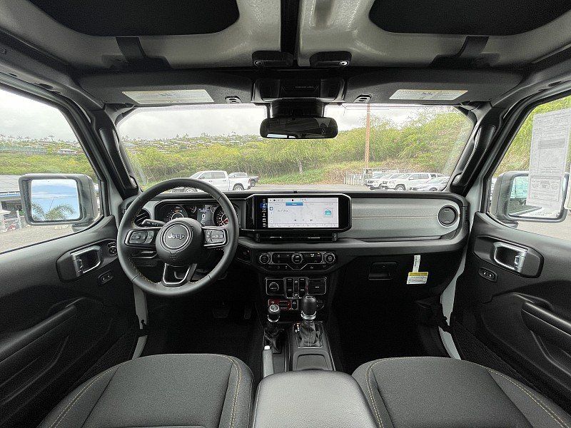 2024 Jeep Wrangler 4-door Willys in a Bright White Clear Coat exterior color. Kona Auto Center 1-888-985-0772 konaautocenter.com 