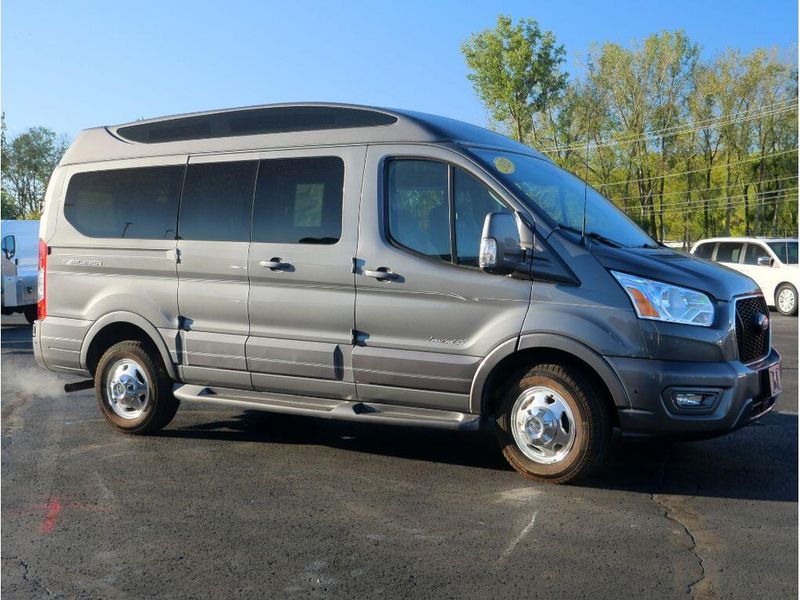 2021 Ford Transit-150 Cargo Van  in a Carbonized Gray Metallic exterior color and Graphiteinterior. Paul Sherry Chrysler Dodge Jeep RAM (937) 749-7061 sherrychrysler.net 