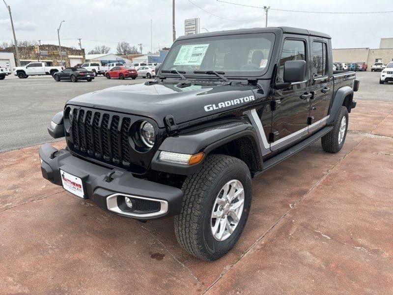 2023 Jeep Gladiator Sport S 4x4 in a Black Clear Coat exterior color and Blackinterior. Matthews Chrysler Dodge Jeep Ram 918-276-8729 cyclespecialties.com 