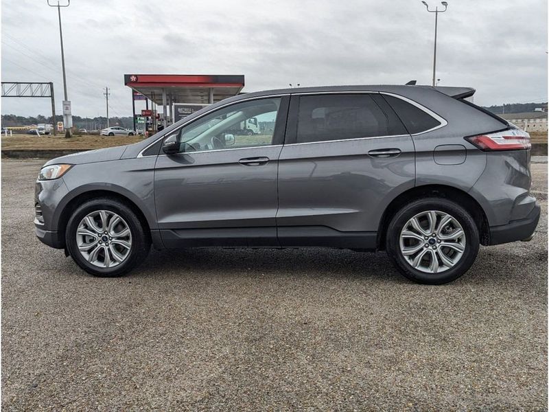 2022 Ford Edge Titanium in a Carbonized Gray Metallic exterior color and Medium Soft Ceramicinterior. Johnson Dodge 601-693-6343 pixelmotiondemo.com 