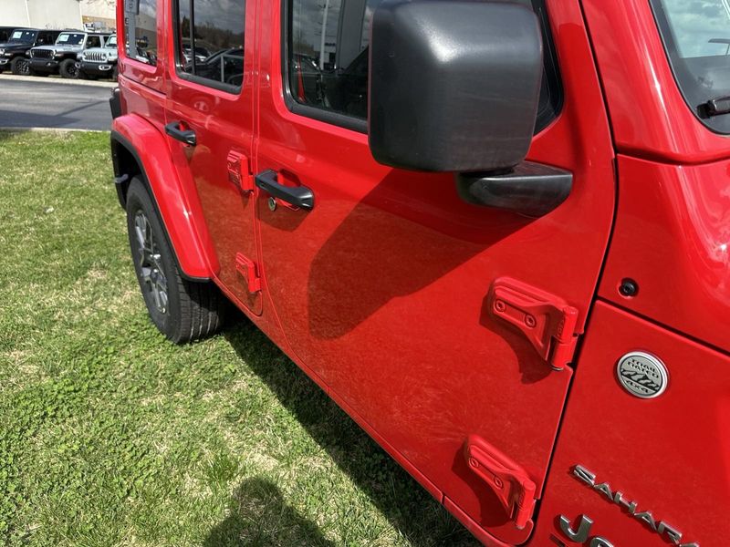 2024 Jeep Wrangler 4-door Sahara in a Firecracker Red Clear Coat exterior color. Gupton Motors Inc 615-384-2886 guptonmotors.com 