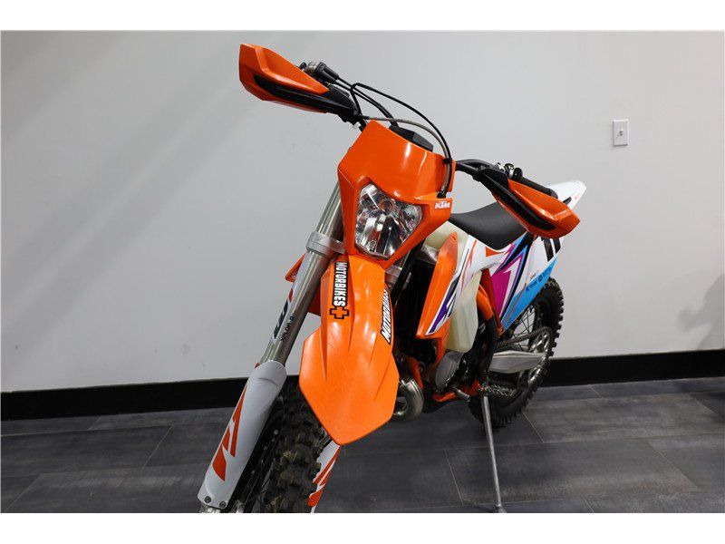 2023 KTM XC 150 W in a Orange exterior color. New England Powersports 978 338-8990 pixelmotiondemo.com 