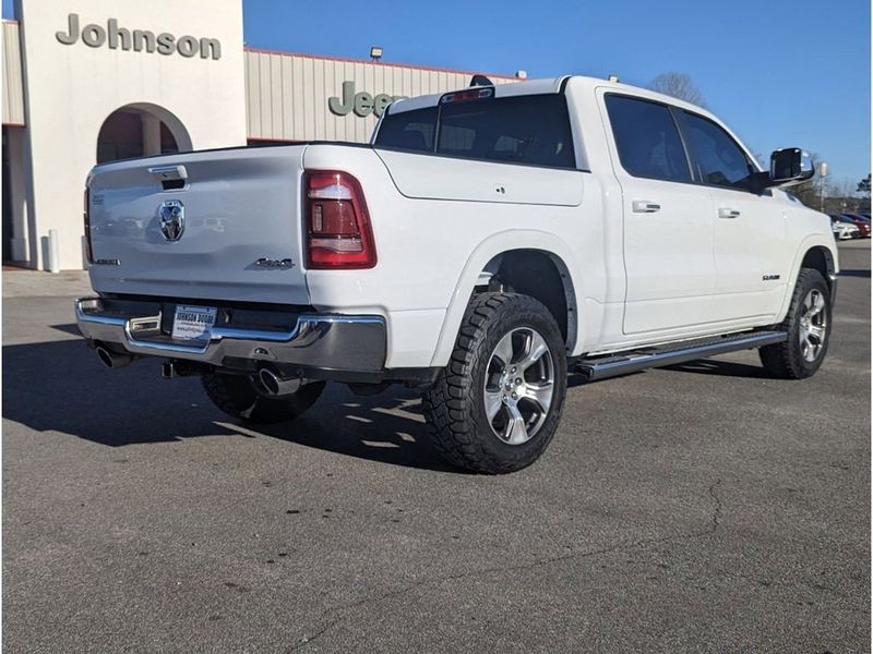 2021 RAM 1500 Laramie in a Bright White Clear Coat exterior color and Light Frost Beige/Mountain Browninterior. Johnson Dodge 601-693-6343 pixelmotiondemo.com 