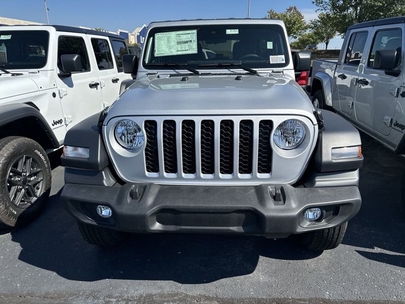 2024 Jeep Wrangler 4-door Sport S in a Silver Zynith Clear Coat exterior color and Blackinterior. CDJR of Anytown 949-555-4321 pixelmotiondemo.com 