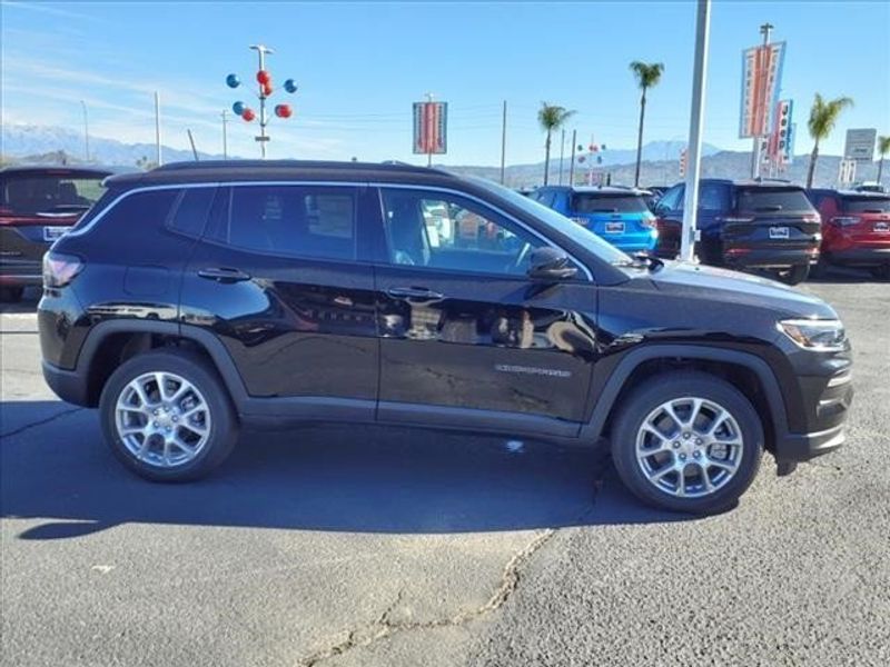 2024 Jeep Compass Latitude Lux in a Diamond Black Crystal Pearl Coat exterior color and Blackinterior. Perris Valley Auto Center 951-657-6100 perrisvalleyautocenter.com 