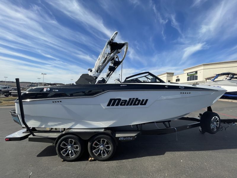 2023 MALIBU M220  in a BLACK/WHITE exterior color. Family PowerSports (877) 886-1997 familypowersports.com 