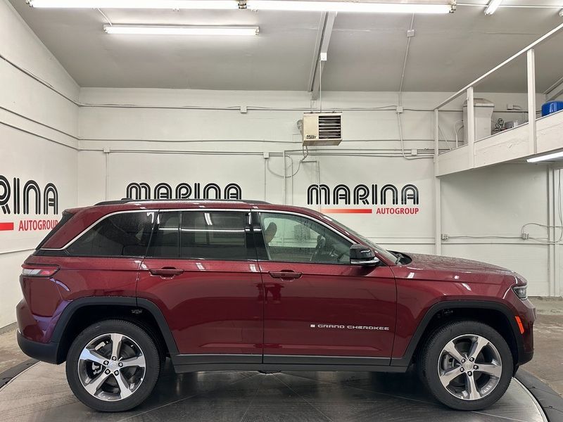 2024 Jeep Grand Cherokee 4xe in a Velvet Red Pearl Coat exterior color and Wicker Beige/Global Blackinterior. Marina Auto Group (855) 564-8688 marinaautogroup.com 