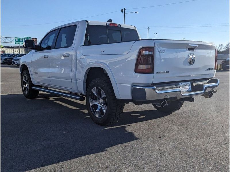 2021 RAM 1500 Laramie in a Bright White Clear Coat exterior color and Light Frost Beige/Mountain Browninterior. Johnson Dodge 601-693-6343 pixelmotiondemo.com 