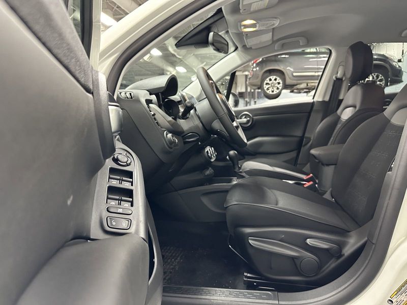 2023 Fiat 500x Pop Awd in a Bianco Gelato (White Clear Coat) exterior color and Blackinterior. Schmelz Countryside Alfa Romeo and Fiat (651) 968-0556 schmelzfiat.com 