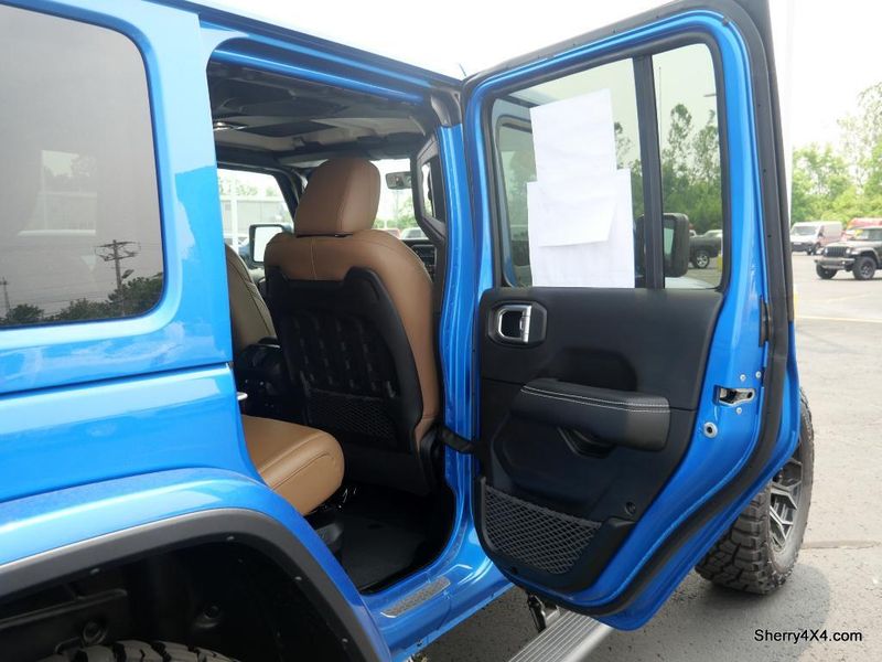 2023 Jeep Wrangler Rubicon 4xe in a Hydro Blue Pearl Coat exterior color and Black/Dark Saddleinterior. Paul Sherry Chrysler Dodge Jeep RAM (937) 749-7061 sherrychrysler.net 