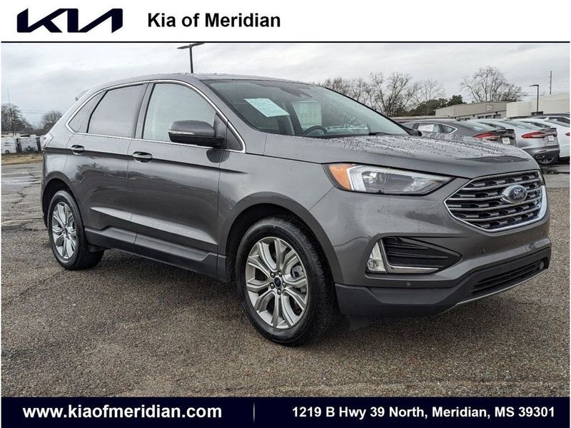 2022 Ford Edge Titanium in a Carbonized Gray Metallic exterior color and Medium Soft Ceramicinterior. Johnson Dodge 601-693-6343 pixelmotiondemo.com 