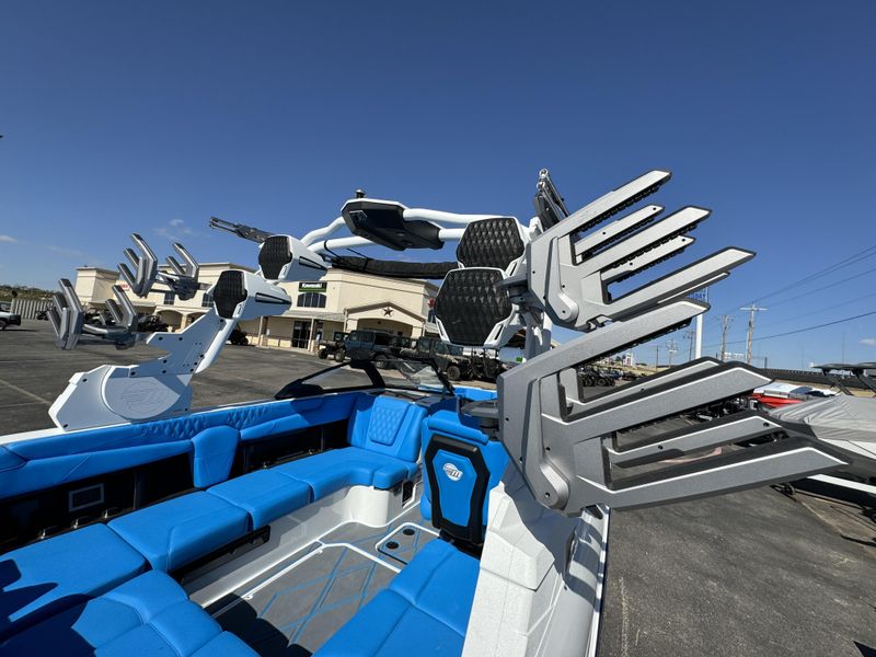 2025 MALIBU MSERIES M230  in a WHITE AND BLUE exterior color. Family PowerSports (877) 886-1997 familypowersports.com 