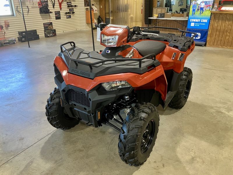 2024 Polaris Sportsman 450 H.O. EPS in a Orange exterior color. Genuine RV & Powersports (936) 569-2523 