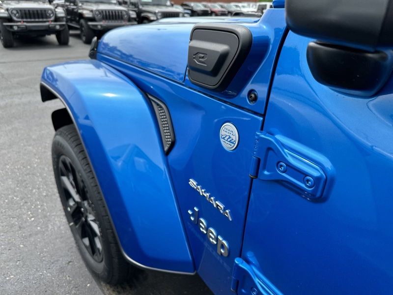 2024 Jeep Wrangler 4-door Sahara 4xe in a Hydro Blue Pearl Coat exterior color. Gupton Motors Inc 615-384-2886 guptonmotors.com 