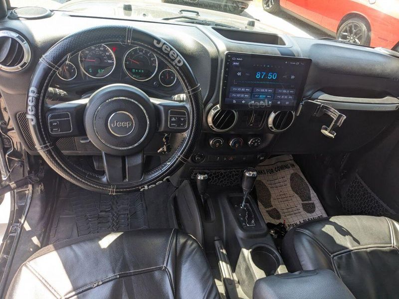 2017 Jeep Wrangler Unlimited Sahara in a Black Clear Coat exterior color and Blackinterior. Johnson Dodge 601-693-6343 pixelmotiondemo.com 