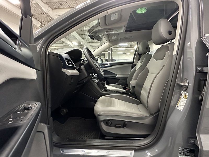 2023 Volkswagen Taos SE w/Sunroof & Black Wheel Pkg in a Pure Gray exterior color and Gray Heated Seatsinterior. Schmelz Countryside SAAB (888) 558-1064 stpaulsaab.com 