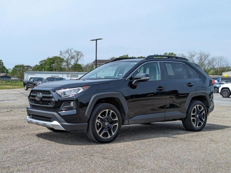 2021 Toyota RAV4 Adventure in a Midnight Black Metallic exterior color. Johnson Dodge 601-693-6343 pixelmotiondemo.com 