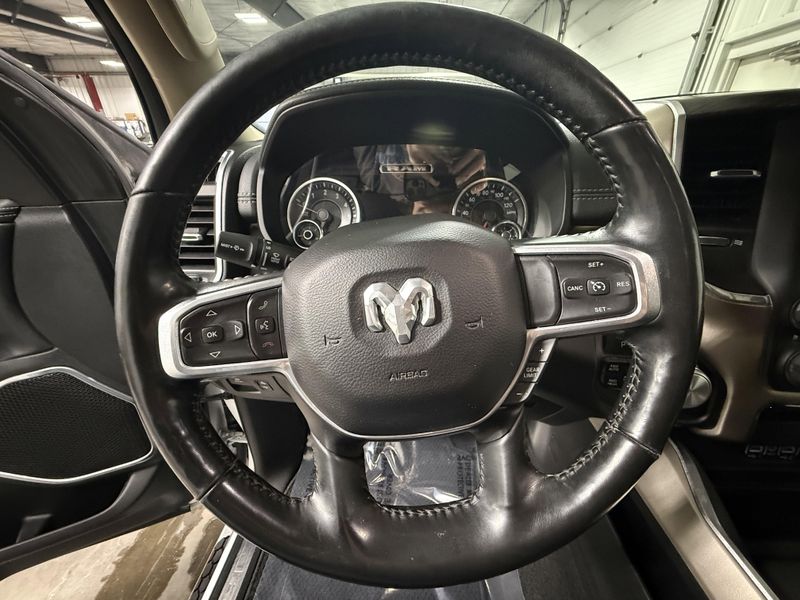 Used 2020 RAM 1500 Laramie in a Bright White Clear Coat exterior color and Blackinterior. Thys Motor Company 319-318-6640 thysmotorco.com 