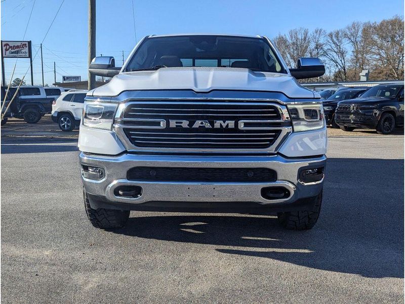 2021 RAM 1500 Laramie in a Bright White Clear Coat exterior color and Light Frost Beige/Mountain Browninterior. Johnson Dodge 601-693-6343 pixelmotiondemo.com 