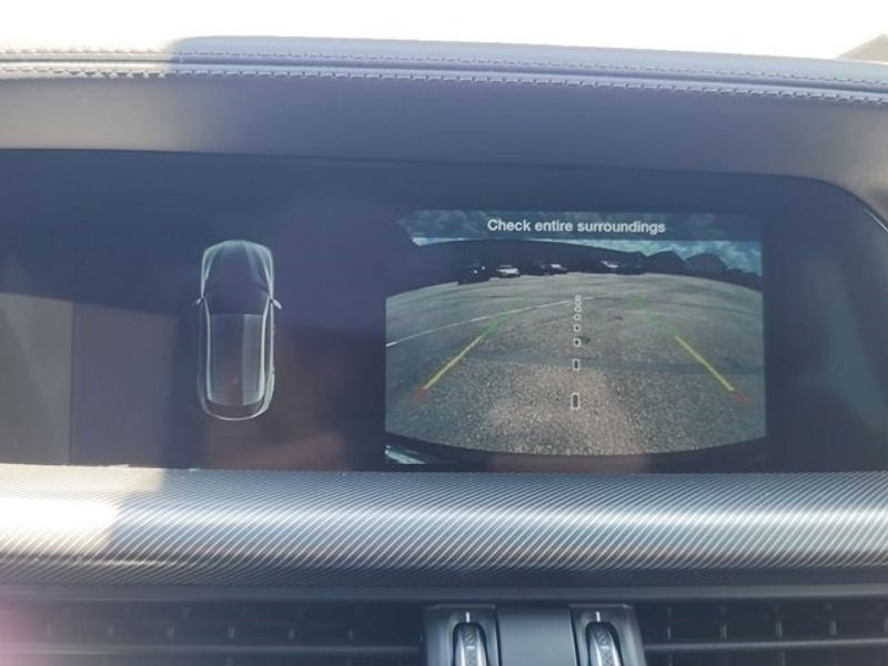 2024 Alfa Romeo Stelvio Ti in a Vulcano Black Metallic exterior color and Chocolateinterior. Northside Imports Houston 281-475-4549 northsideimportshouston.com 