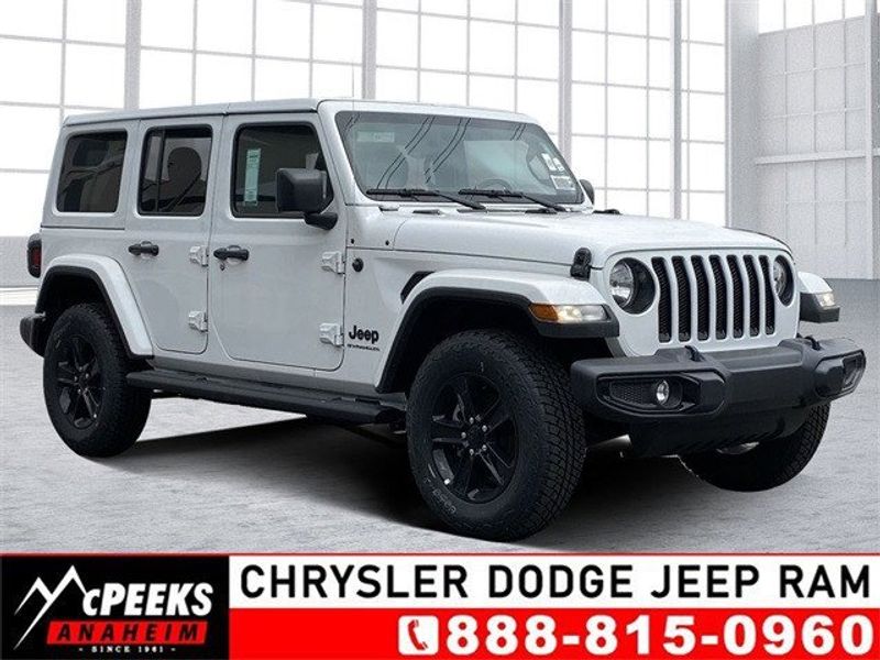 2023 Jeep Wrangler 4-door Sahara Altitude 4x4 in a Bright White Clear Coat exterior color and Blackinterior. McPeek