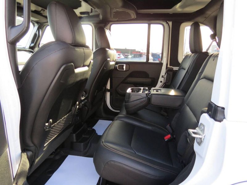 2024 Jeep Wrangler 4-door Sahara in a Bright White Clear Coat exterior color and Blackinterior. Militello Motors ​507-200-4344 militellomotors.net 