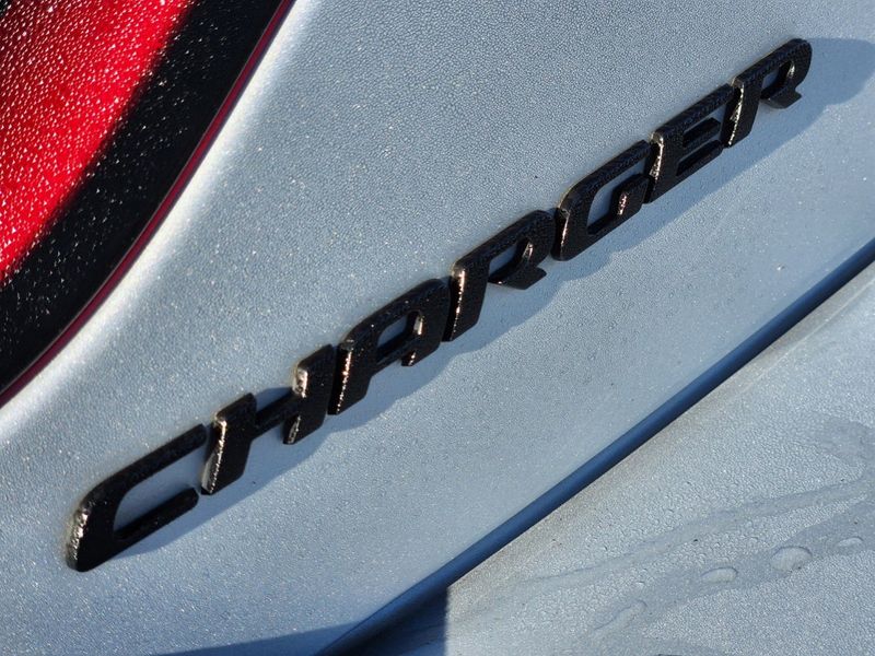 2022 Dodge Charger R/T in a Triple Nickel Clear Coat exterior color and Blackinterior. Elder Chrysler Dodge Jeep Ram 9032920419 elderchryslerdodgejeep.com 
