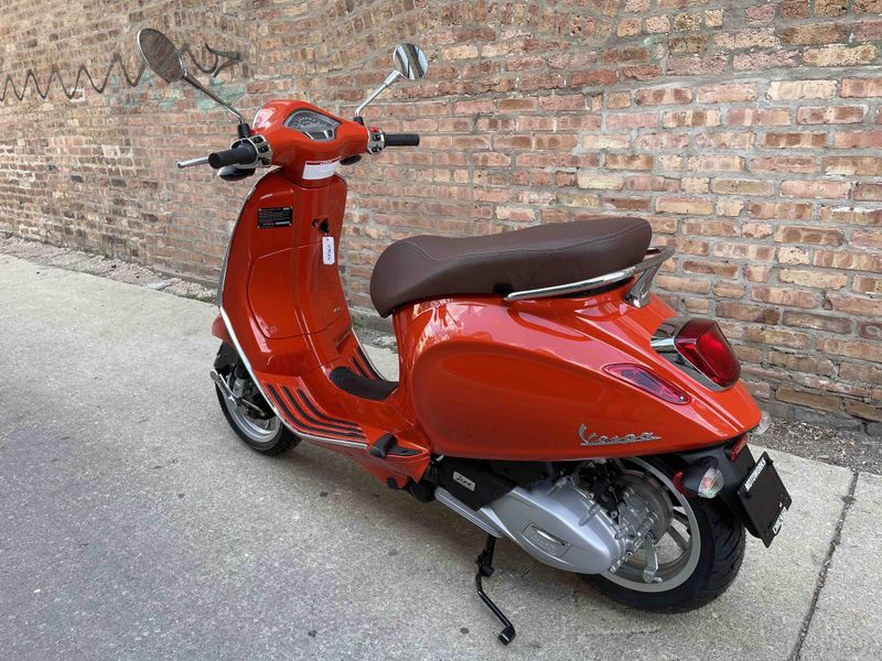2023 Vespa Primavera 50 in a Orange Arancia Impulsivo exterior color. Motoworks Chicago 312-738-4269 motoworkschicago.com 
