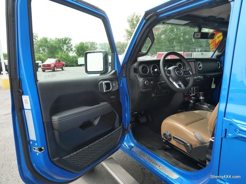 2023 Jeep Wrangler Rubicon 4xe in a Hydro Blue Pearl Coat exterior color and Black/Dark Saddleinterior. Paul Sherry Chrysler Dodge Jeep RAM (937) 749-7061 sherrychrysler.net 