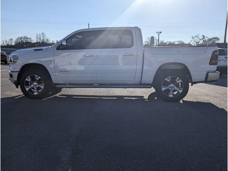 2021 RAM 1500 Laramie in a Bright White Clear Coat exterior color and Light Frost Beige/Mountain Browninterior. Johnson Dodge 601-693-6343 pixelmotiondemo.com 