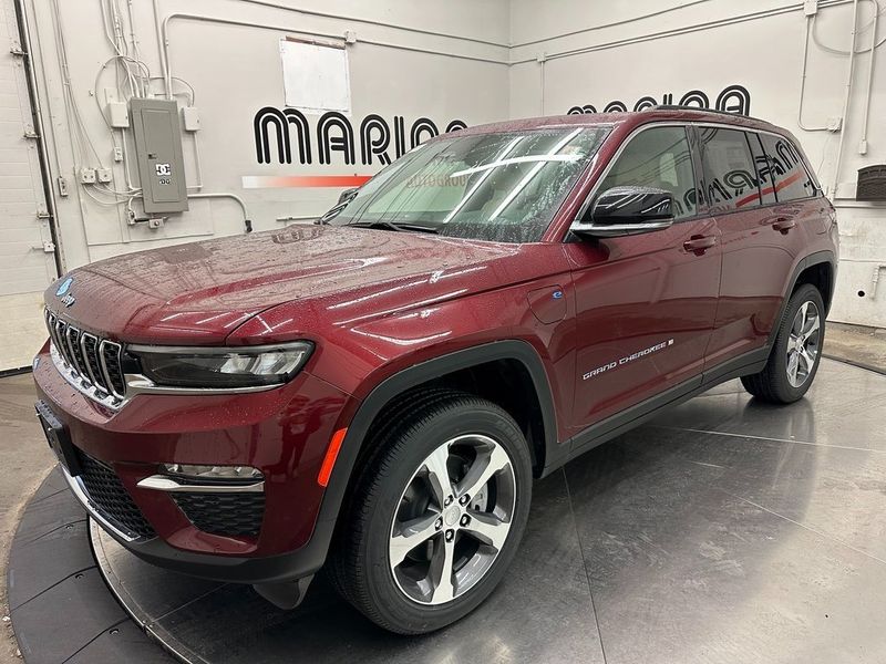 2024 Jeep Grand Cherokee 4xe in a Velvet Red Pearl Coat exterior color and Wicker Beige/Global Blackinterior. Marina Auto Group (855) 564-8688 marinaautogroup.com 