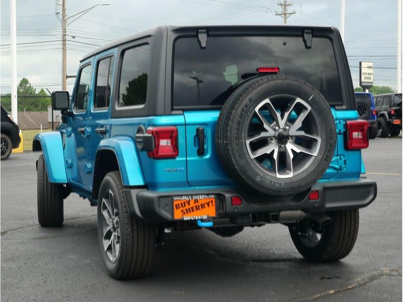 2024 Jeep Wrangler 4-door Sport S 4xe in a Bikini Pearl Coat exterior color and Blackinterior. Paul Sherry Chrysler Dodge Jeep RAM (937) 749-7061 sherrychrysler.net 