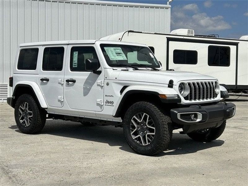 Jeep Wrangler 4xE Sahara in a Bright White Clear Coat exterior color and Blackinterior. McPeek