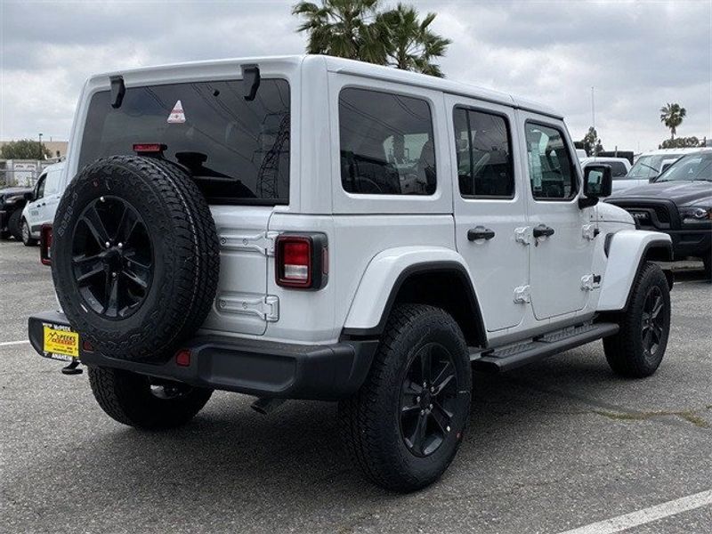 2023 Jeep Wrangler 4-door Sahara Altitude 4x4 in a Bright White Clear Coat exterior color and Blackinterior. McPeek
