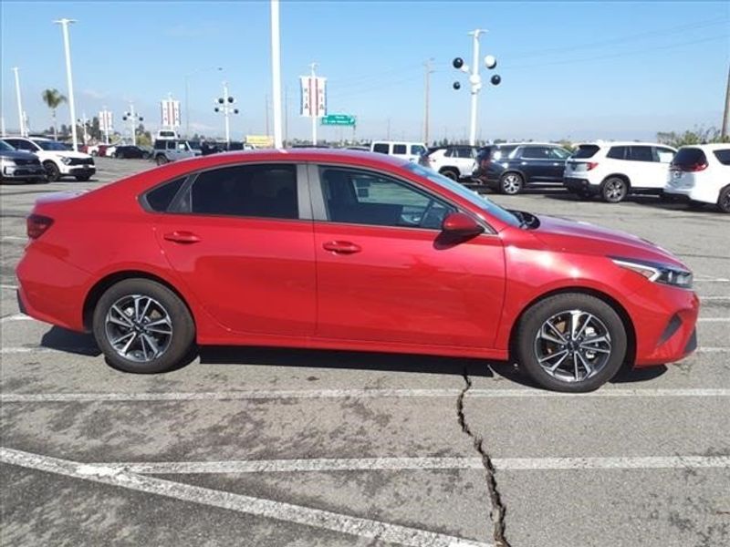2023 Kia Forte LXS in a Currant Red exterior color and Blackinterior. Perris Valley Auto Center 951-657-6100 perrisvalleyautocenter.com 