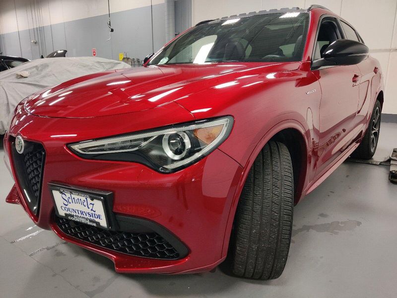 2023 Alfa Romeo Stelvio Veloce Q4 AWD w/Prem & Activ Pkg in a Rosso Etna exterior color and Black Heated Sport Leatherinterior. Schmelz Countryside Alfa Romeo and Fiat (651) 968-0556 schmelzfiat.com 