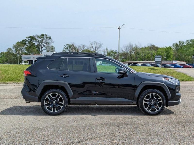 2021 Toyota RAV4 Adventure in a Midnight Black Metallic exterior color. Johnson Dodge 601-693-6343 pixelmotiondemo.com 