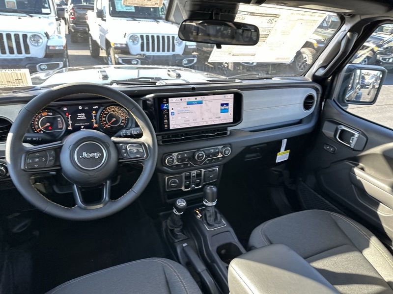 2024 Jeep Wrangler 4-door Sport S in a Black Clear Coat exterior color and Blackinterior. Gupton Motors Inc 615-384-2886 guptonmotors.com 