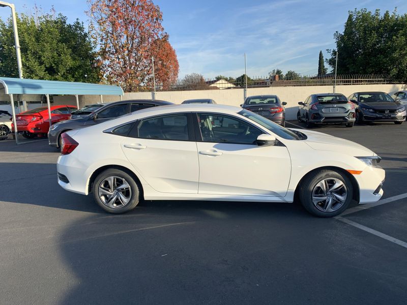2020 Honda Civic Sedan LX in a White exterior color. BEACH BLVD OF CARS beachblvdofcars.com 