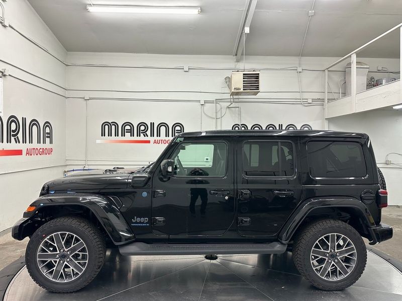 2024 Jeep Wrangler 4-door High Altitude 4xe in a Black Clear Coat exterior color and Green/Blackinterior. Marina Auto Group (855) 564-8688 marinaautogroup.com 