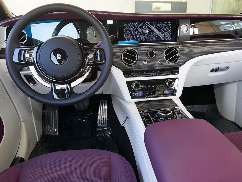 2024 Rolls-Royce Spectre  in a Twilight Purple exterior color and Arctic Whiteinterior. SHELLY AUTOMOTIVE shellyautomotive.com 