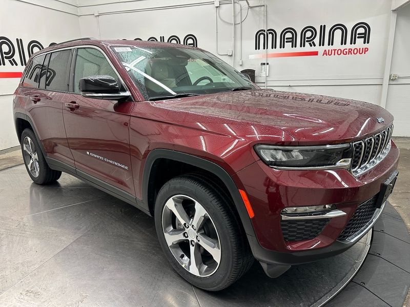 2024 Jeep Grand Cherokee 4xe in a Velvet Red Pearl Coat exterior color and Wicker Beige/Global Blackinterior. Marina Auto Group (855) 564-8688 marinaautogroup.com 