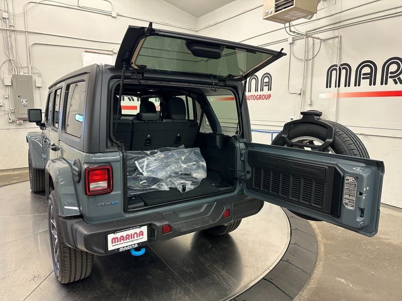 2024 Jeep Wrangler 4-door Sport S 4xe in a Anvil Clear Coat exterior color and Blackinterior. Marina Chrysler Dodge Jeep RAM (855) 616-8084 marinadodgeny.com 